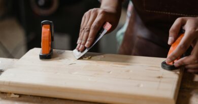 man using a sander