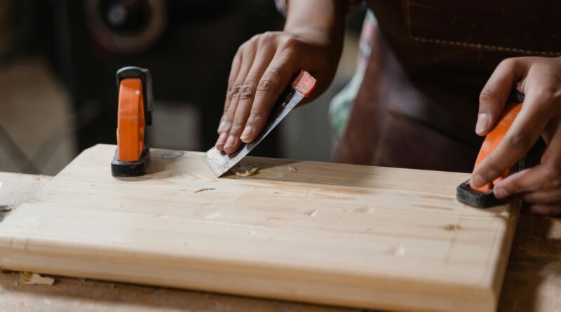 man using a sander