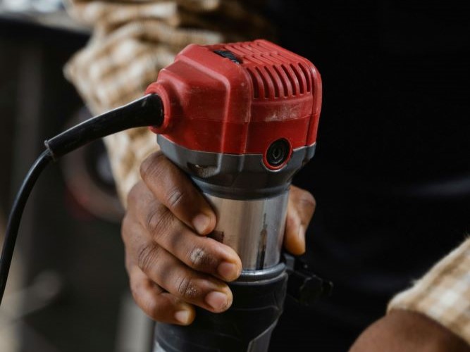 a man working with a shaper machine