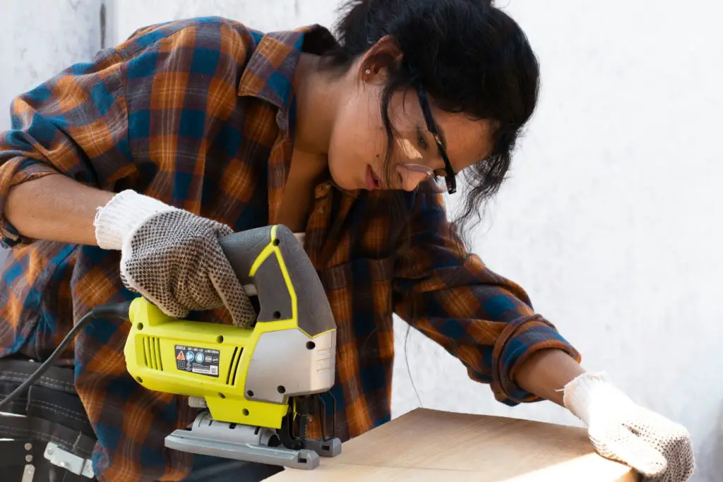 a woman working with a corded router