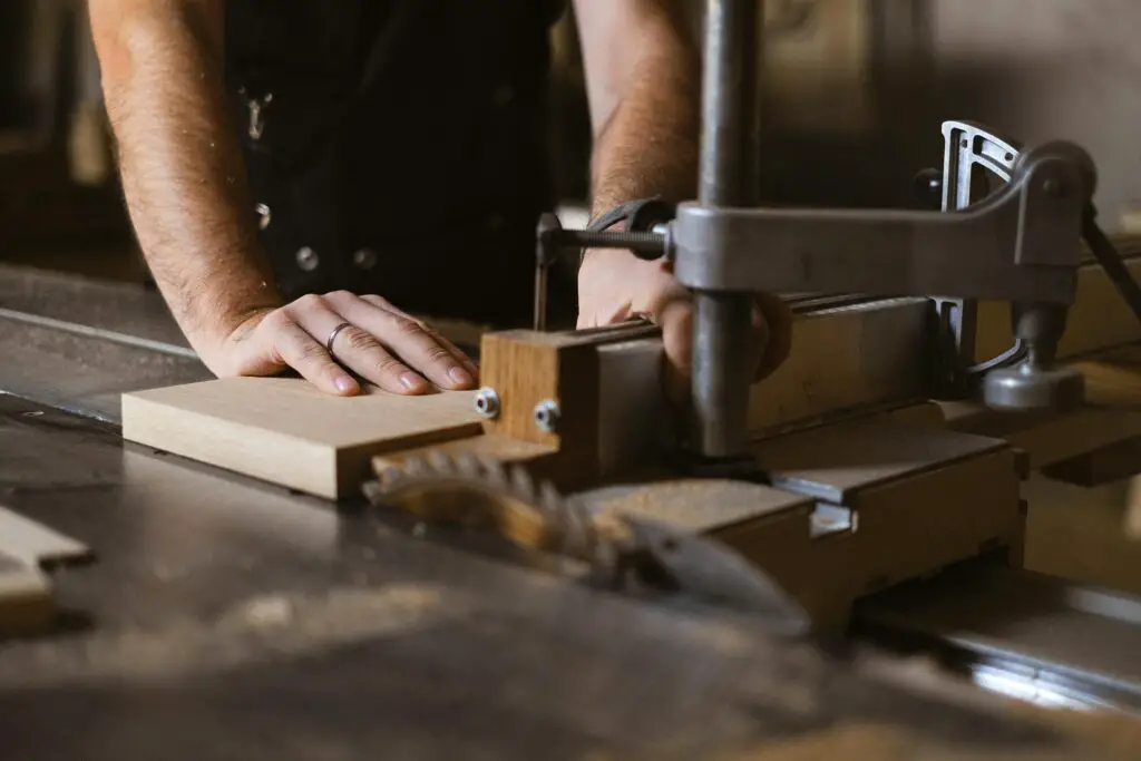 a man using a wood router machine