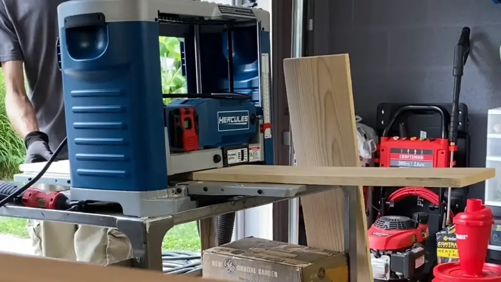 man working with a wood planer