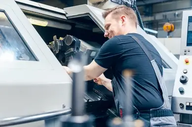 man working with ct560 cnc lathe