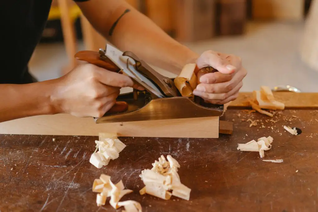 man working with an affordable hand planer