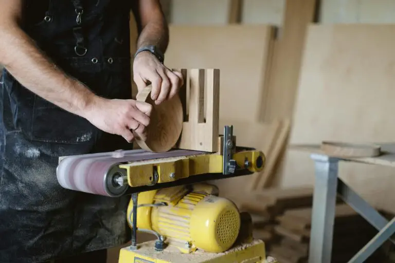 a man working with a disc sander