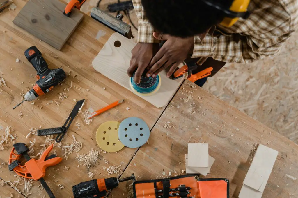 man working with a disc sander